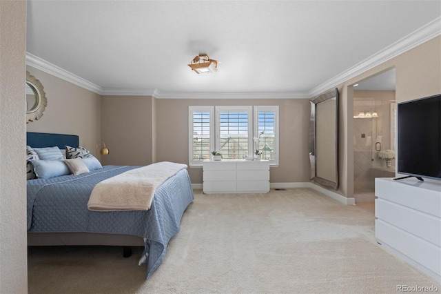 bedroom featuring carpet, baseboards, crown molding, and ensuite bathroom