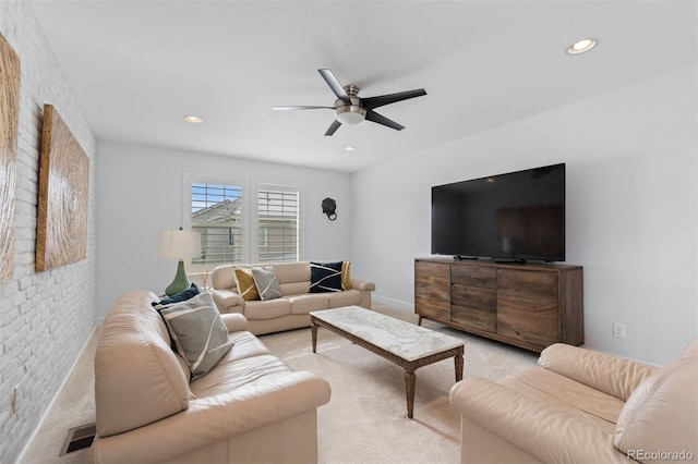 living room featuring light carpet, ceiling fan, and recessed lighting