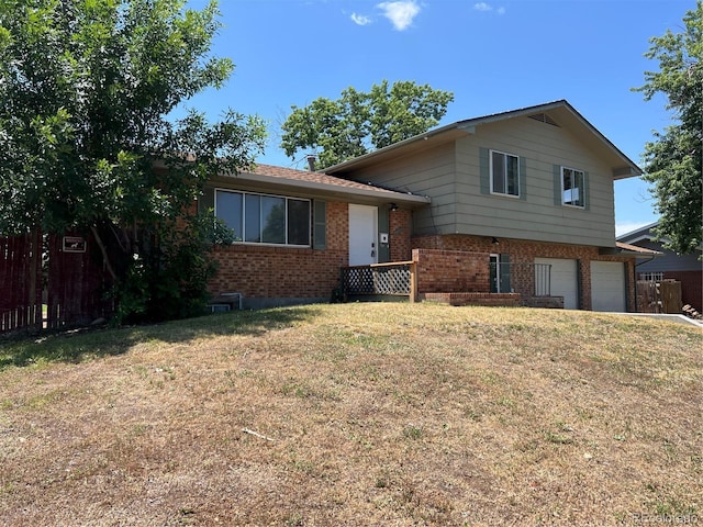 12252 Elmendorf Pl, Denver, CO 80239 - tri-level home with brick siding and an attached garage