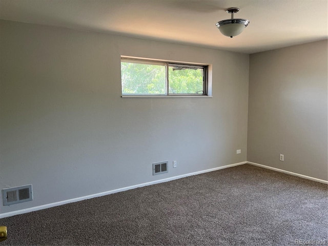 12252 Elmendorf Pl, Denver, CO 80239 - unfurnished room featuring dark carpet and baseboards