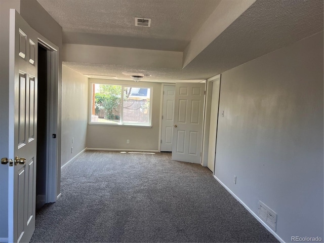 12252 Elmendorf Pl, Denver, CO 80239 - carpeted spare room featuring a textured ceiling and baseboards