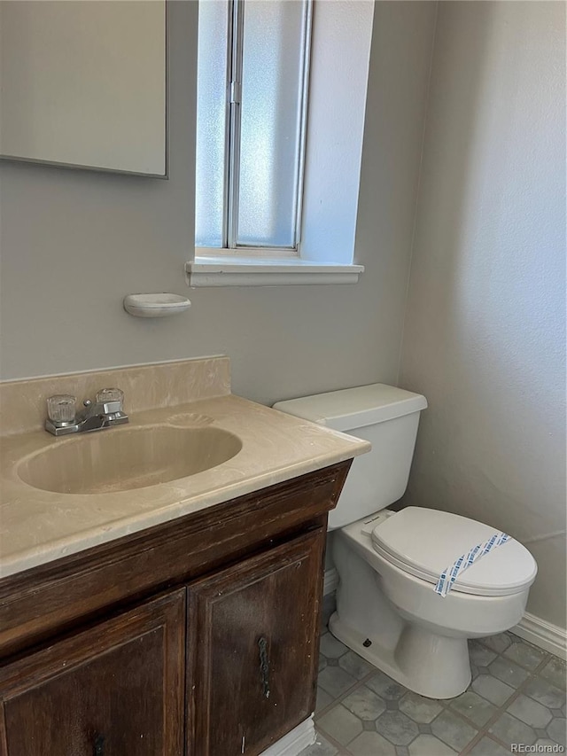 12252 Elmendorf Pl, Denver, CO 80239 - half bathroom featuring vanity and tile patterned flooring