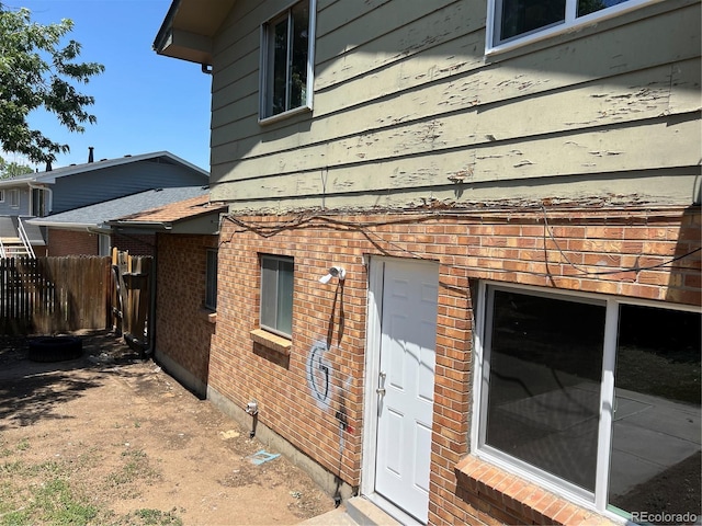 12252 Elmendorf Pl, Denver, CO 80239 - view of home's exterior featuring brick siding