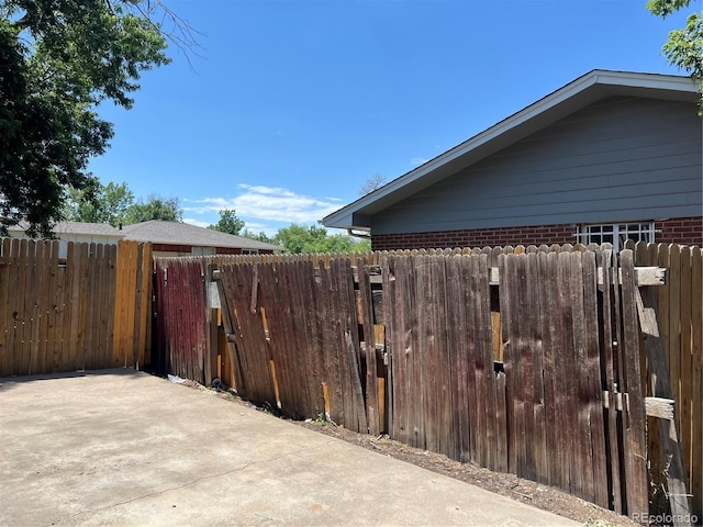 12252 Elmendorf Pl, Denver, CO 80239 - view of home's exterior with brick siding