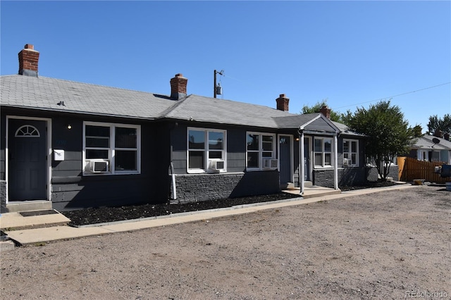 single story home featuring cooling unit