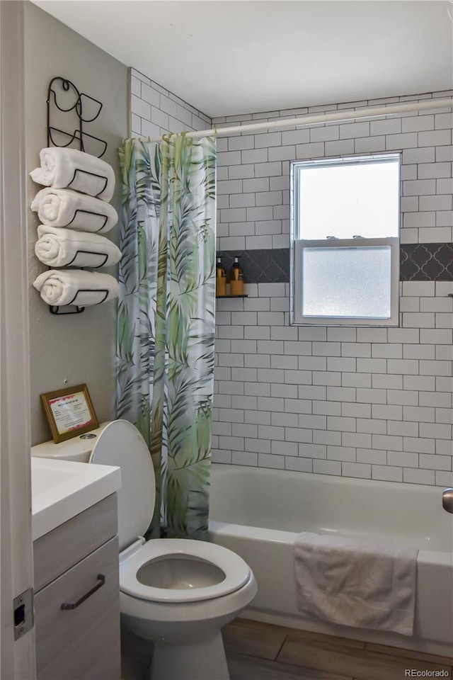 full bathroom with shower / bath combo, vanity, and toilet