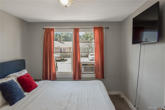 bedroom featuring carpet floors and cooling unit