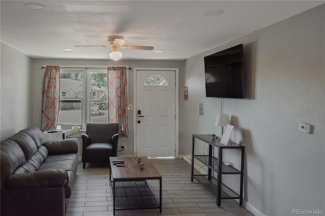 living room featuring ceiling fan