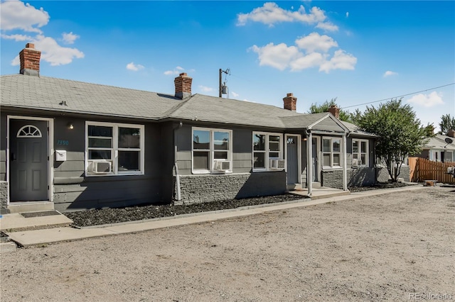 view of front of home with cooling unit