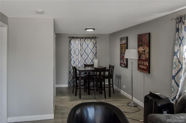 dining area with light hardwood / wood-style flooring