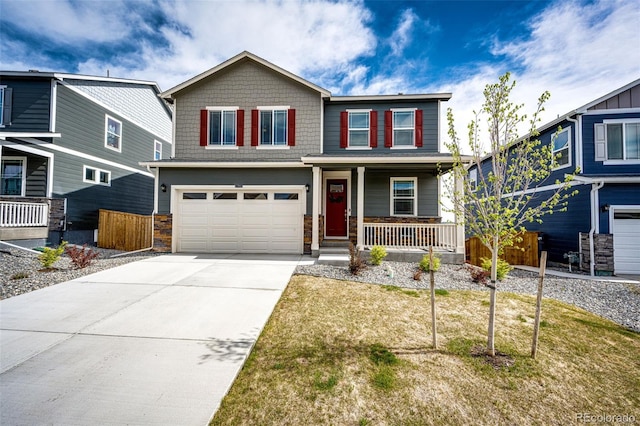 craftsman-style house with a porch, stone siding, an attached garage, and driveway
