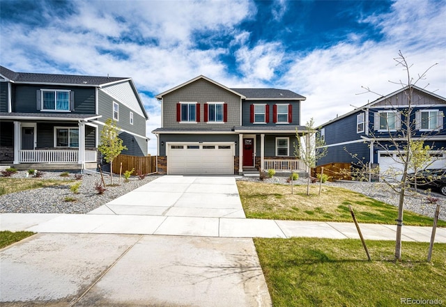 craftsman-style house with covered porch, concrete driveway, a garage, and stone siding