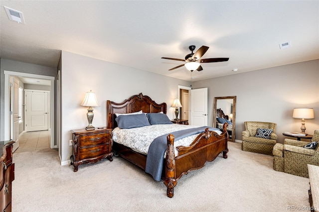 bedroom featuring light colored carpet, ceiling fan, and baseboards