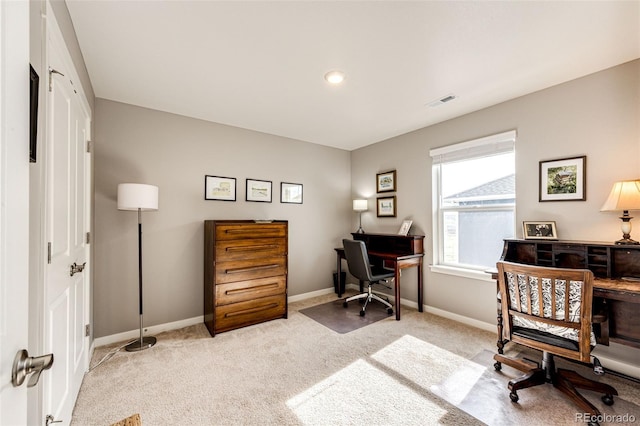 office space featuring light colored carpet and baseboards