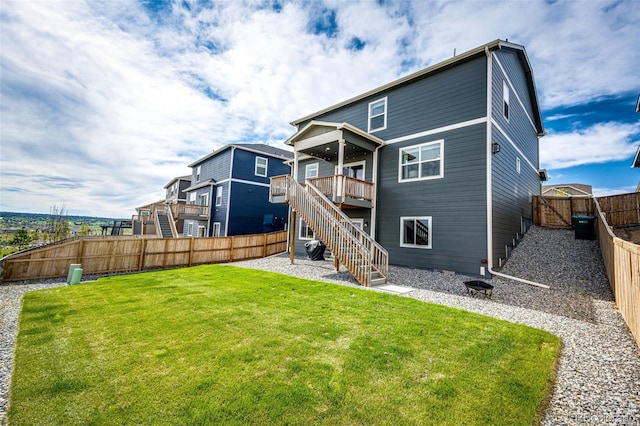 back of property featuring stairway and a deck