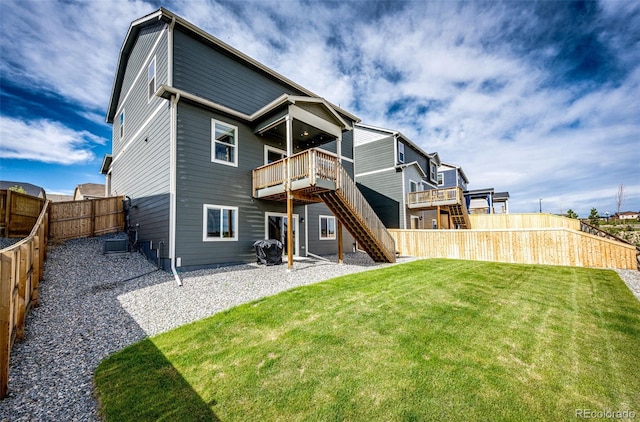 back of property featuring stairs and a wooden deck
