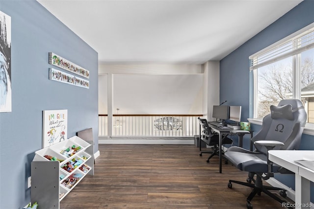 home office with dark hardwood / wood-style flooring