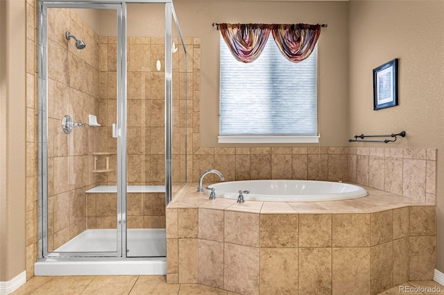 full bath with a stall shower, tile patterned flooring, and a garden tub