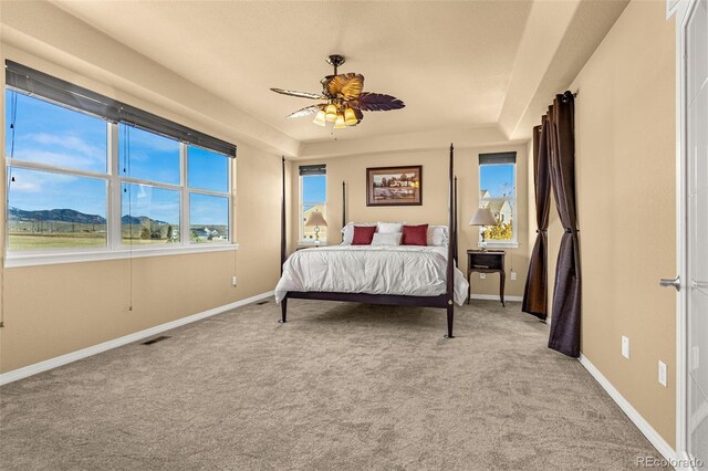 bedroom with ceiling fan, carpet, visible vents, and baseboards