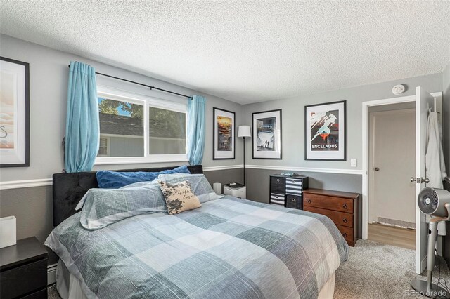 13 Nome Way Unit A, Aurora, CO 80012 - bedroom featuring carpet floors and a textured ceiling