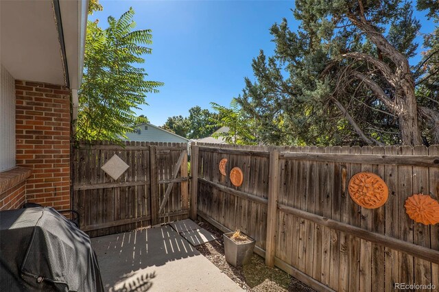 13 Nome Way Unit A, Aurora, CO 80012 - view of patio featuring a gate and a fenced backyard