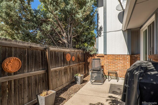 13 Nome Way Unit A, Aurora, CO 80012 - view of patio / terrace with a fenced backyard and area for grilling