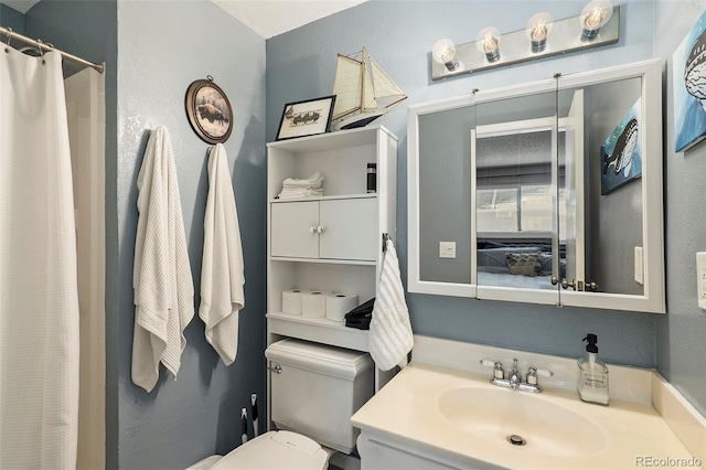 13 Nome Way Unit A, Aurora, CO 80012 - full bathroom with vanity, a textured wall, a shower with shower curtain, and toilet