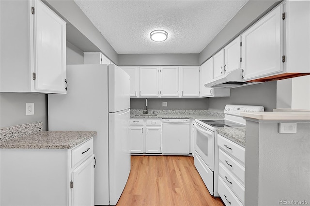 kitchen with white appliances, light wood finished floors, white cabinetry, a textured ceiling, and a sink