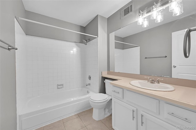full bathroom with tile patterned flooring, toilet,  shower combination, and vanity