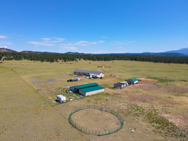 drone / aerial view featuring a rural view and a mountain view