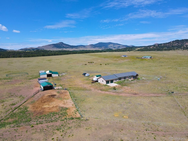 birds eye view of property featuring a mountain view and a rural view