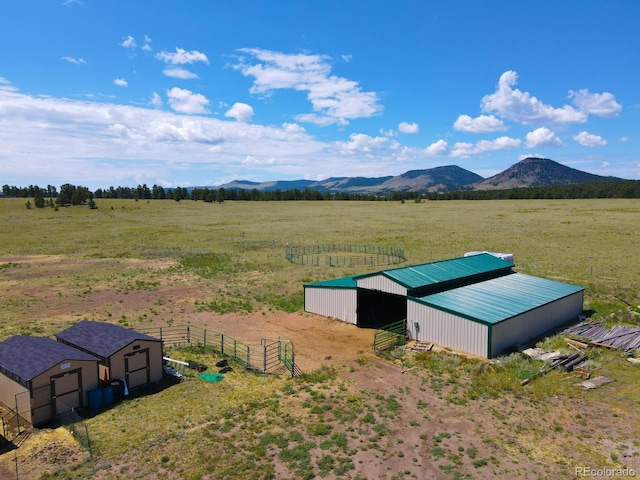 drone / aerial view featuring a rural view and a mountain view