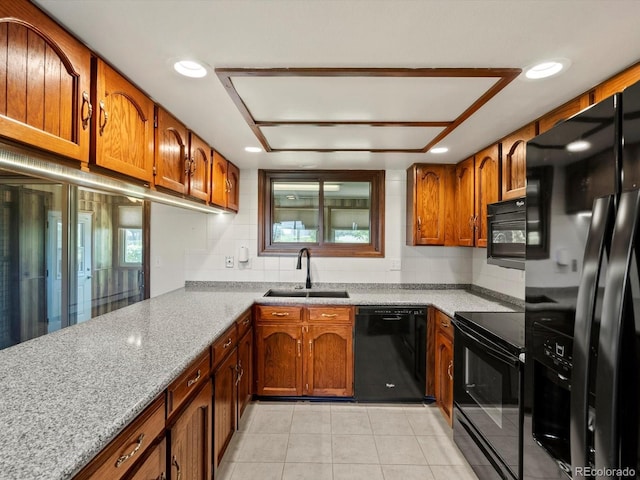 3780 W 66th Ave, Arvada, CO 80003 - kitchen with black appliances, a sink, brown cabinetry, and recessed lighting