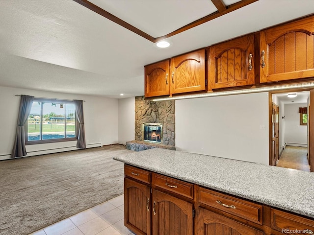 3780 W 66th Ave, Arvada, CO 80003 - kitchen featuring light carpet, light tile patterned floors, light countertops, recessed lighting, and brown cabinets