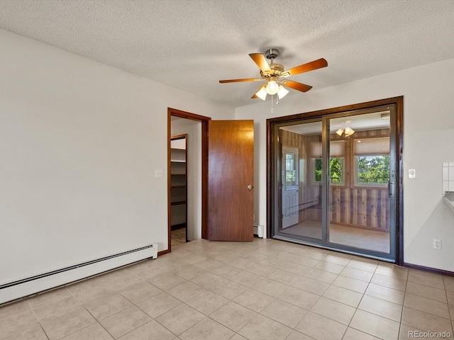3780 W 66th Ave, Arvada, CO 80003 - empty room featuring a baseboard radiator, baseboard heating, a ceiling fan, a textured ceiling, and light tile patterned floors