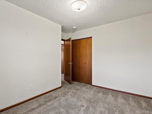 3780 W 66th Ave, Arvada, CO 80003 - carpeted spare room featuring baseboards and a textured ceiling