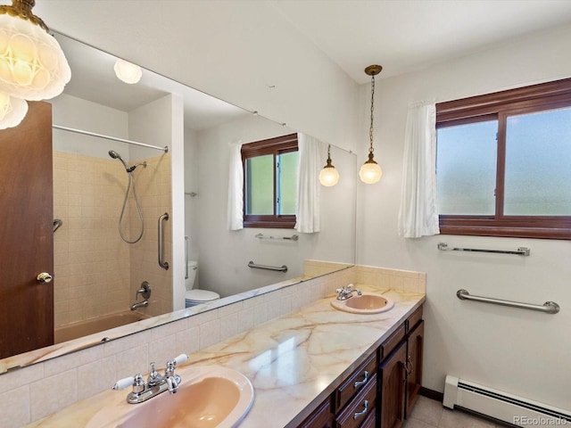 3780 W 66th Ave, Arvada, CO 80003 - bathroom featuring baseboard heating, toilet, healthy amount of natural light, and double vanity