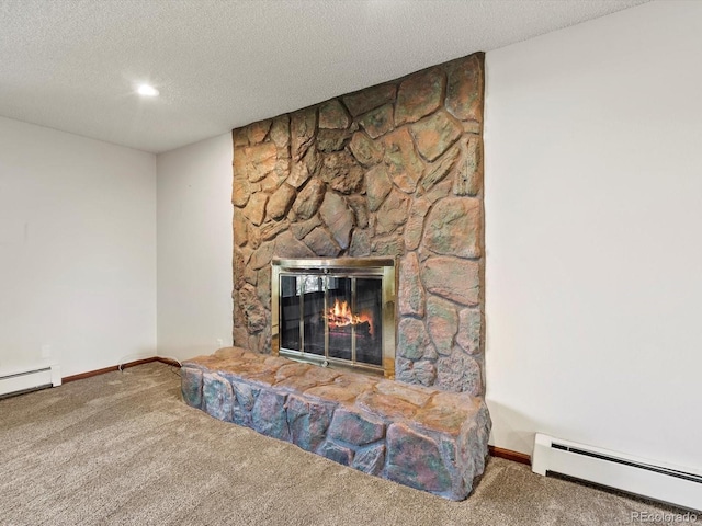 3780 W 66th Ave, Arvada, CO 80003 - detailed view of a baseboard heating unit, carpet floors, a fireplace, a textured ceiling, and a baseboard radiator