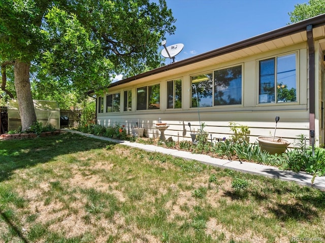 3780 W 66th Ave, Arvada, CO 80003 - view of home's exterior featuring a lawn