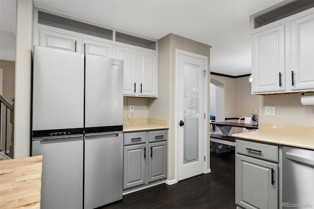 2066 Amber Ct, Erie, CO 80516 - kitchen with stainless steel appliances, dark wood finished floors, light countertops, and white cabinetry