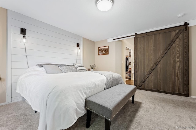 2066 Amber Ct, Erie, CO 80516 - bedroom featuring light colored carpet, a barn door, a spacious closet, and a closet