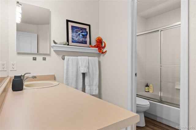 2066 Amber Ct, Erie, CO 80516 - bathroom with vanity, combined bath / shower with glass door, and wood finished floors