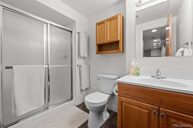 2066 Amber Ct, Erie, CO 80516 - bathroom with vanity, a stall shower, and wood finished floors