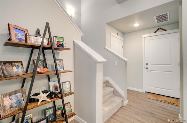 5477 Passport Vw, Colorado Springs, CO 80922 - stairs featuring wood finished floors and baseboards