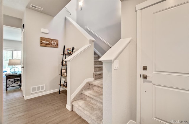 5477 Passport Vw, Colorado Springs, CO 80922 - staircase featuring baseboards and wood finished floors