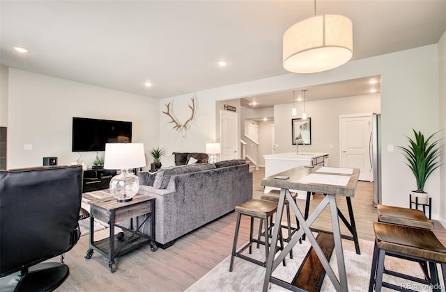 5477 Passport Vw, Colorado Springs, CO 80922 - living room featuring light wood-style flooring and recessed lighting