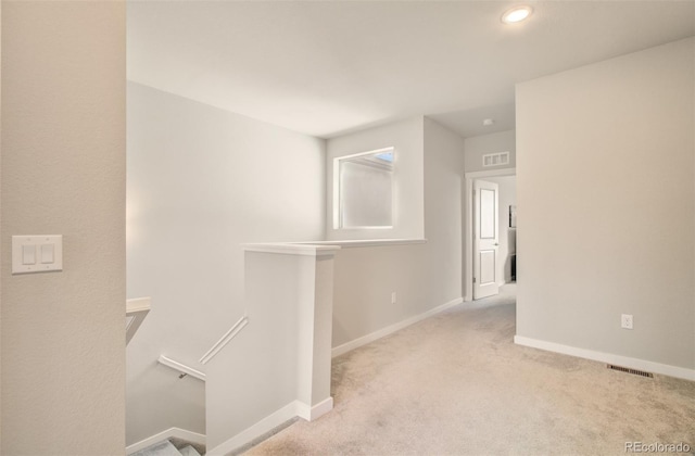 5477 Passport Vw, Colorado Springs, CO 80922 - hall with an upstairs landing, carpet floors, baseboards, and recessed lighting