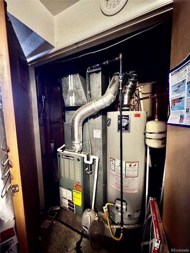 utility room featuring gas water heater