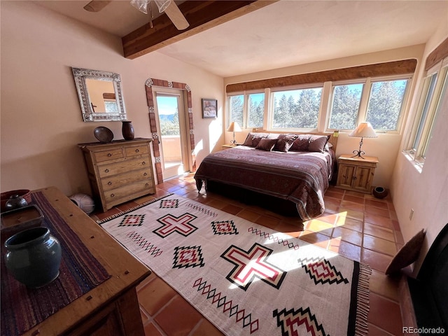 bedroom with beamed ceiling and light tile patterned floors