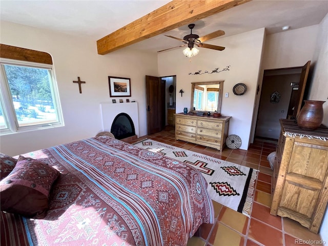 bedroom featuring tile patterned flooring, a fireplace, and beam ceiling